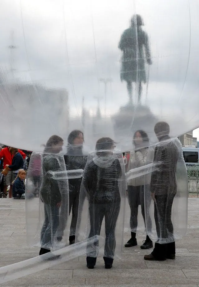Conversation Bubble inflated on a hillside in Odda, Norway, with participants' heads inside it