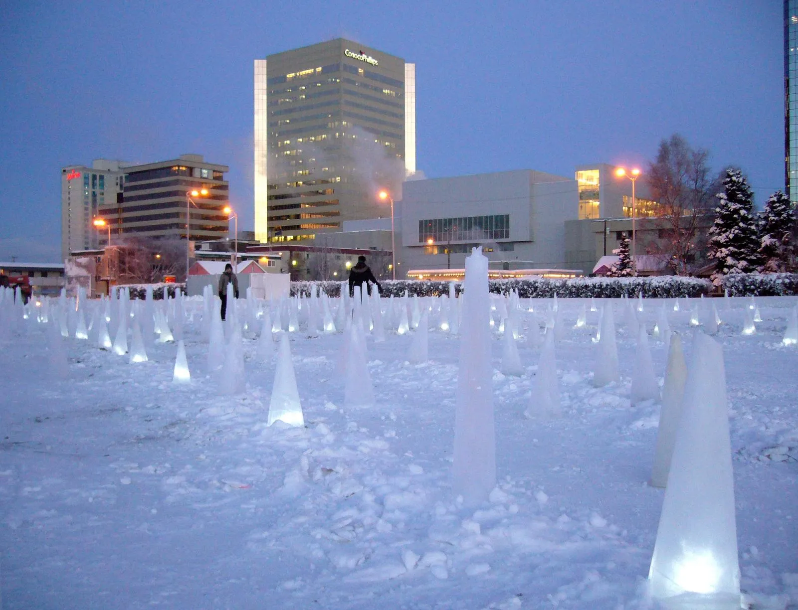 Detail of illuminated pylon casts forming crack lines in the ice